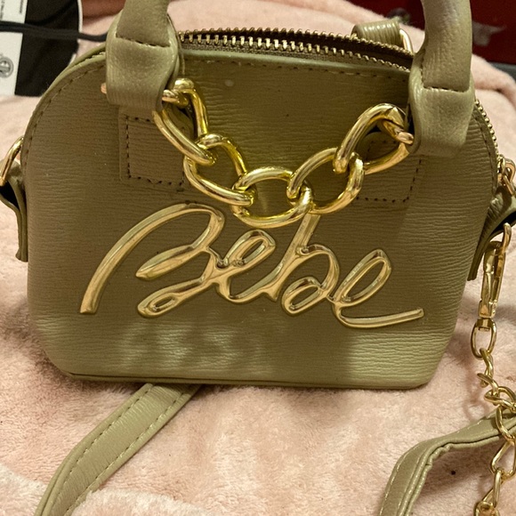 Tan Bebe purse small for when you don’t have much to carry. - Picture 1 of 3